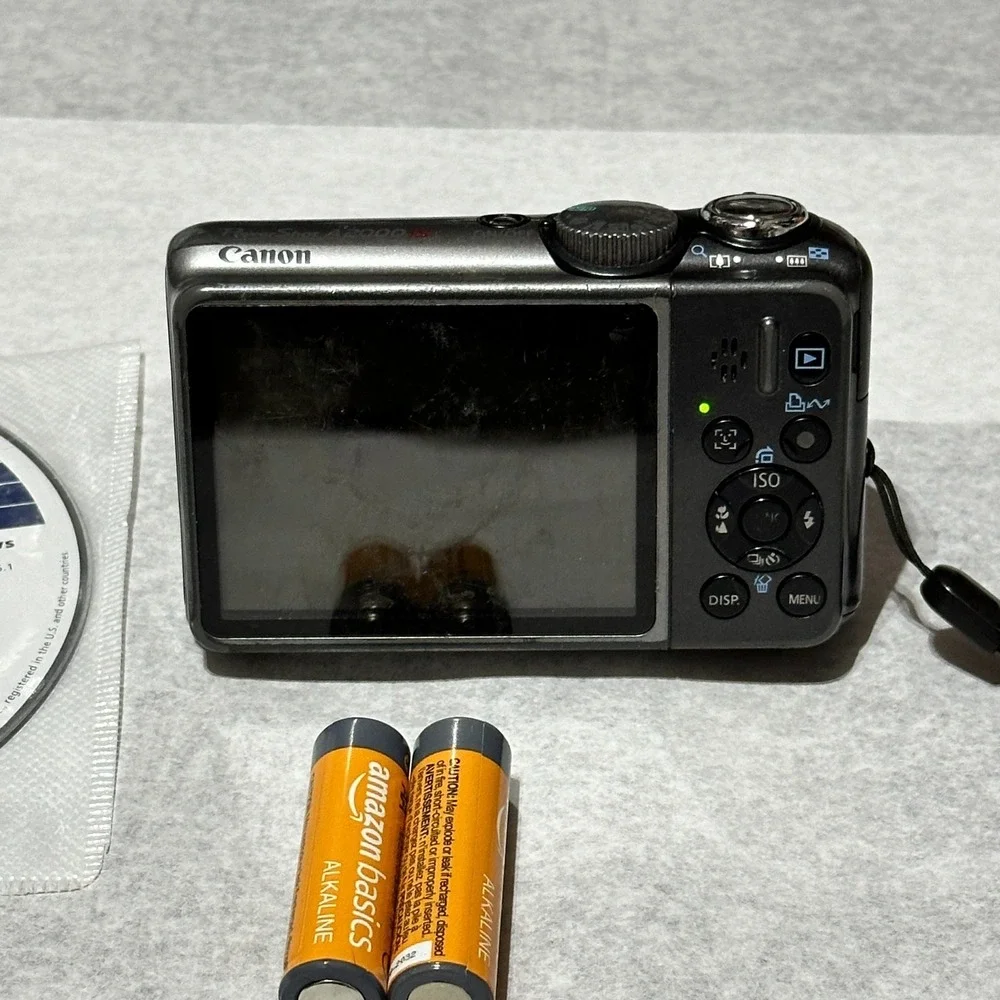 Canon PowerShot A2000 IS 10MP Digital Camera Pink For Parts Or Repair Lens Error